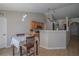 Inviting dining area with kitchen views and modern light fixtures at 31920 Parkdale Dr, Leesburg, FL 34748