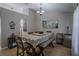Bright dining room featuring a table, chairs, and an artistic accent at 31920 Parkdale Dr, Leesburg, FL 34748