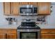 Bright kitchen with stainless steel microwave and electric oven/range at 31920 Parkdale Dr, Leesburg, FL 34748