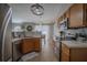 Open kitchen layout with stainless steel appliances and wood-style flooring at 31920 Parkdale Dr, Leesburg, FL 34748