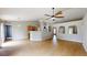 Open-concept living area featuring wood floors and kitchen with a breakfast bar at 31920 Parkdale Dr, Leesburg, FL 34748