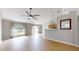 Bright living area with a ceiling fan and sliding glass doors leading to outdoor space at 31920 Parkdale Dr, Leesburg, FL 34748