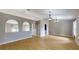 Spacious living area with wood floors, arched doorways, and views into adjacent rooms at 31920 Parkdale Dr, Leesburg, FL 34748