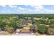 Aerial view of a sprawling property surrounded by lush trees and greenery at 32132 Hickory Ln, Sorrento, FL 32776