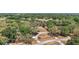 Aerial view of property featuring mature trees, a circular driveway, and a home nestled in a private setting at 32132 Hickory Ln, Sorrento, FL 32776
