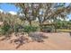 An outdoor living space with a fire pit and pergola with outdoor seating for entertaining in the backyard at 32132 Hickory Ln, Sorrento, FL 32776