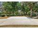 Outdoor basketball court with mature shade trees, offering a fun recreational space at 32132 Hickory Ln, Sorrento, FL 32776