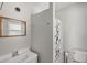 Clean and bright bathroom featuring a vanity with sink and a shower with curtain at 32132 Hickory Ln, Sorrento, FL 32776