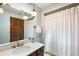 Bathroom featuring a vanity with vintage faucet, light fixtures, and shower with curtain at 32132 Hickory Ln, Sorrento, FL 32776