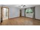 Bedroom with hardwood floors, ensuite bathroom and natural light at 32132 Hickory Ln, Sorrento, FL 32776