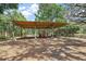 Spacious covered carport featuring a tractor, perfect for storing large equipment at 32132 Hickory Ln, Sorrento, FL 32776