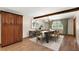Dining room featuring wood floors, a wood beam, and a view of the outdoors at 32132 Hickory Ln, Sorrento, FL 32776