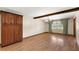 Dining room, highlighting the wood floors, wood beam, and ample space at 32132 Hickory Ln, Sorrento, FL 32776
