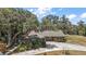 Beautiful brick home with a well-maintained front yard and mature trees at 32132 Hickory Ln, Sorrento, FL 32776