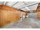 An unfinished garage featuring block wall, and a concrete floor at 32132 Hickory Ln, Sorrento, FL 32776