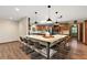 Gourmet kitchen with a center island, granite counters, custom wood cabinets, and a breakfast bar at 32132 Hickory Ln, Sorrento, FL 32776