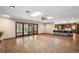 Spacious living room with hardwood floors, skylights, ceiling fan, and kitchen with breakfast bar at 32132 Hickory Ln, Sorrento, FL 32776