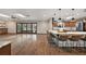 Open-concept living space with hardwood floors connects seamlessly to the kitchen and backyard, offering a versatile and inviting space at 32132 Hickory Ln, Sorrento, FL 32776