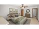 Stylishly furnished main bedroom featuring neutral decor and an ensuite bathroom at 32132 Hickory Ln, Sorrento, FL 32776