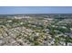 An aerial view of a neighborhood and shopping center showing the extent of local development at 334 Shiloh Ct, The Villages, FL 32162