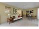 Comfortable lanai with tile flooring features large windows and ceiling fan at 334 Shiloh Ct, The Villages, FL 32162