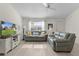 Inviting living space features modern decor, ample natural light, and a seamless flow into the dining area at 334 Shiloh Ct, The Villages, FL 32162