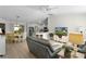 Open-concept living space with modern furnishings, a view of the kitchen, and abundant natural light at 334 Shiloh Ct, The Villages, FL 32162