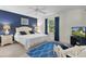 Stylish main bedroom features a serene color palette and ample natural light at 334 Shiloh Ct, The Villages, FL 32162