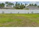 View of the backyard featuring a white fence and lush green grass perfect for relaxing or entertaining at 3638 Sw 127Th Lane Rd, Ocala, FL 34473