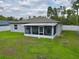 Aerial view of screened in porch, lawn and fenced backyard at 3638 Sw 127Th Lane Rd, Ocala, FL 34473
