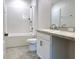 Bathroom features a shower-tub combo with tile surround and a vanity with storage at 3638 Sw 127Th Lane Rd, Ocala, FL 34473