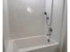 Newly remodeled bathroom with a clean, bright white tiled shower and tub at 3638 Sw 127Th Lane Rd, Ocala, FL 34473