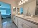 Bathroom featuring a double vanity and access to the bedroom at 3638 Sw 127Th Lane Rd, Ocala, FL 34473