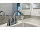 Close-up of a bathroom sink featuring a sleek faucet and clean countertop at 3638 Sw 127Th Lane Rd, Ocala, FL 34473