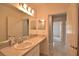 Well-lit bathroom with a large vanity area and access to additional rooms at 3638 Sw 127Th Lane Rd, Ocala, FL 34473