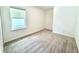 A carpeted bedroom with a window providing natural light, offering a cozy and private space at 3638 Sw 127Th Lane Rd, Ocala, FL 34473
