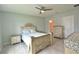 Comfortable bedroom with tile floors, a ceiling fan, and decorative furnishings at 3638 Sw 127Th Lane Rd, Ocala, FL 34473