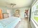 Bedroom featuring a ceiling fan, dresser, and serene decor at 3638 Sw 127Th Lane Rd, Ocala, FL 34473