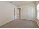 This bedroom has wall to wall carpeting and a large closet at 3638 Sw 127Th Lane Rd, Ocala, FL 34473