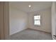 This bedroom has wall to wall carpet and a single window at 3638 Sw 127Th Lane Rd, Ocala, FL 34473