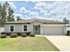 Charming single-story home features a well-maintained lawn and attached two car garage at 3638 Sw 127Th Lane Rd, Ocala, FL 34473