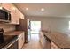 Modern kitchen featuring stainless steel appliances, ample countertop space, and white cabinetry at 3638 Sw 127Th Lane Rd, Ocala, FL 34473