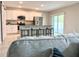 Modern kitchen with white cabinets, granite countertops, and stainless steel appliances at 3638 Sw 127Th Lane Rd, Ocala, FL 34473
