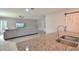 Open-concept kitchen features a granite island with sink and view to the living room at 3638 Sw 127Th Lane Rd, Ocala, FL 34473
