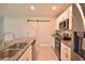 Bright kitchen features granite countertops, stainless steel appliances, and stylish white cabinets at 3638 Sw 127Th Lane Rd, Ocala, FL 34473