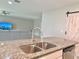 Modern kitchen featuring granite countertops and stainless steel appliances at 3638 Sw 127Th Lane Rd, Ocala, FL 34473