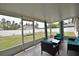 Relaxing screened-in lanai with comfortable seating, perfect for enjoying the outdoors at 3638 Sw 127Th Lane Rd, Ocala, FL 34473