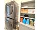 Convenient laundry room with modern washer and dryer with added storage shelves at 3638 Sw 127Th Lane Rd, Ocala, FL 34473