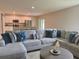 Spacious living room with stylish sectional couch connected to kitchen at 3638 Sw 127Th Lane Rd, Ocala, FL 34473