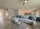 Spacious living room with tile floors, modern furniture, and an open concept design at 3638 Sw 127Th Lane Rd, Ocala, FL 34473